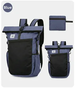 Detail view of foldable blue outdoor backpack with mesh pocket and roll-top closure system