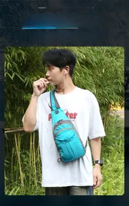 Sky blue hiking daypack detail featuring a built-in earphone hole and waterproof nylon
