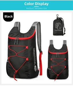 Detail view of foldable outdoor backpack in black with red zipper and grey mesh straps