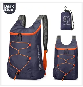 Foldable outdoor backpack in dark blue with orange accents and compact storage pouch
