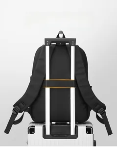 Close-up of the luggage strap on the back of a black backpack for travel convenience