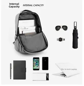 Detail of the minimalist gray backpack showing spacious 14-inch laptop storage compartment