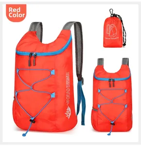 Foldable red hiking backpack showing compact storage bag and breathable mesh straps