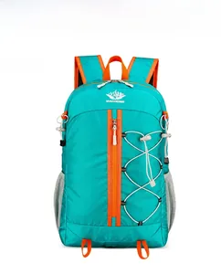 Front view of a blue outdoor backpack with orange zippers and elastic cord detail