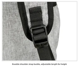 Detail of sturdy black plastic buckle and adjustable woven strap on gray backpack