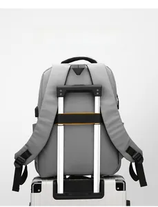 Water-resistant commuter backpack with trolley strap securely fixed to luggage handle