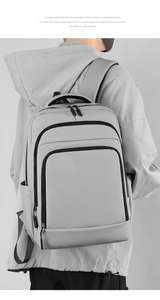 Macro shot of grey water-resistant backpack showing high-quality fabric and side pockets