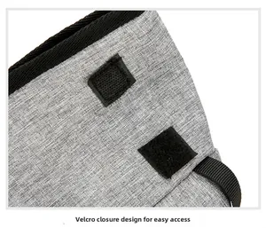Detail of grey fabric outdoor bag featuring square Velcro closure for easy item access