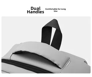 Detail of grey commute backpack with padded dual handles and durable stitching