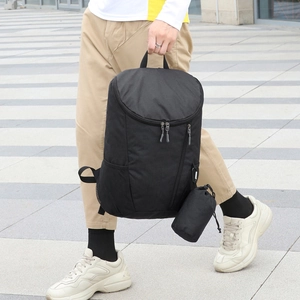 Waterproof black travel backpack set with high capacity and cylindrical accessory pouch