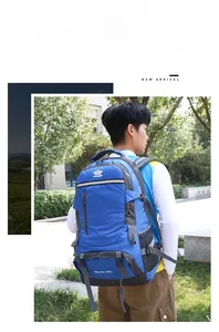 Blue 60L outdoor hiking backpack with ergonomic straps shown on male model back