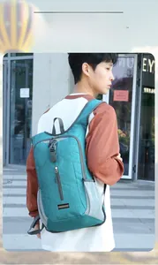 Outdoor cycling backpack in light green fabric with mesh side pockets and front zipper