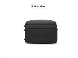 Detailed bottom view of black minimalist backpack showing waterproof synthetic fabric