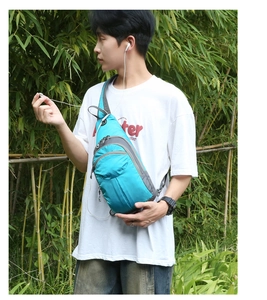 Close-up of hiking daypack with turquoise waterproof fabric and earphone port detail