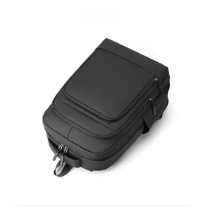 Detailed top view of a black water-resistant business laptop backpack with multiple zippers