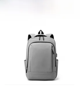 Front view of waterproof business laptop backpack in grey with integrated USB port