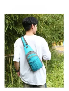 Bright blue hiking chest bag on model, featuring tear-resistant nylon and adjustable strap