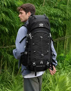 Close-up of a 60L outdoor hiking backpack with VANAHEIMR logo in a natural forest setting