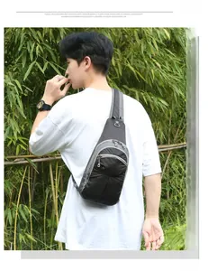 Close-up of hiking daypack showing multi-layered zipper pockets and earphone port