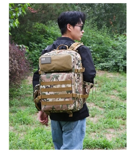 Detail of outdoor tactical camouflage backpack showing MOLLE system and padded shoulder straps