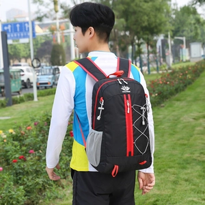 Lightweight foldable outdoor backpack in black with red accents for hiking and travel
