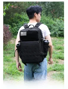 Detailed back view of a black tactical backpack with Molle system and American flag patch