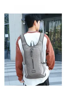Detail view of the lightweight foldable backpack with front zipper pocket and mesh side bag
