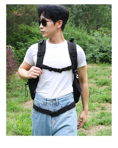 Outdoor tactical backpack detail showing padded shoulder straps and secure chest buckle