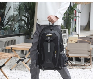 Detail of 40L hiking backpack showing side compression straps and mesh pockets