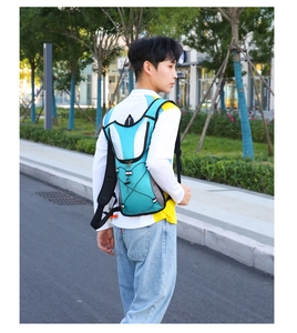 Outdoor hydration backpack with teal water-repellent fabric and breathable mesh straps