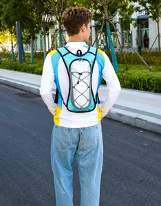 Blue outdoor cycling backpack with reflective panel and elastic cords on model