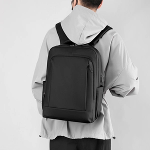 Versatile black water-resistant business laptop backpack for commuting and travel use
