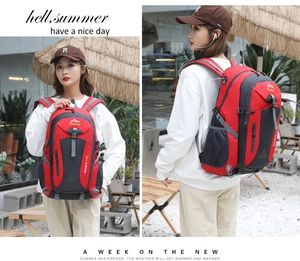Detail of red 40L outdoor hiking backpack with side mesh pockets and durable ripstop fabric