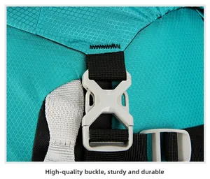 Macro detail of high-quality turquoise buckle and durable straps on a hiking backpack