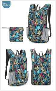 Detail view of foldable waterproof backpack with tropical leaf print and storage pouch