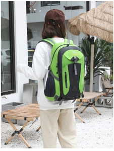 Outdoor 40L green hiking backpack with multi-compartment design and side mesh pocket