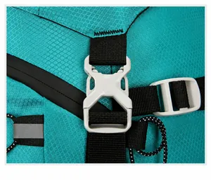 Detailed close-up of teal ripstop nylon hiking backpack with durable grey plastic buckle