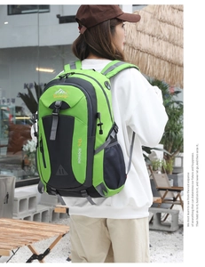 Detail of 40L outdoor hiking backpack in green and grey with adjustable side straps