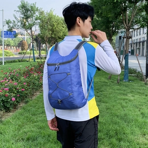 Lightweight blue foldable nylon outdoor backpack featuring elastic drawstring for travel