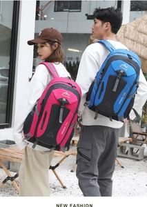 Outdoor 40L hiking backpacks in pink and blue displayed on a scenic patio setting