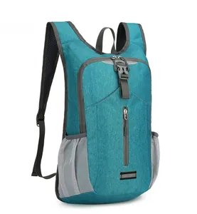 Detail of lightweight cycling backpack showing teal ripstop fabric and mesh side pockets