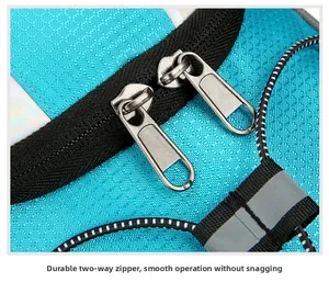 Detail of durable dual-way metal zippers and reflective strip on blue cycling backpack