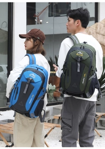 Detail showing blue and army green 40L outdoor backpacks with mesh back system