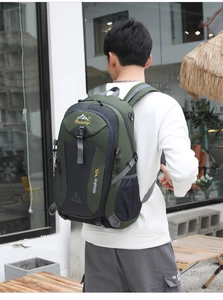 Outdoor model carrying 40L army green trekking backpack with adjustable side straps