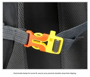 Detail of a bright orange chest strap buckle on a 60L outdoor hiking backpack