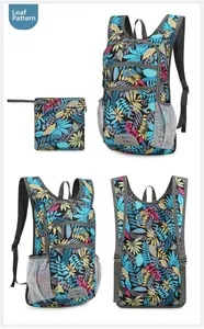 Detail of water-resistant foldable hiking backpack with vibrant colorful leaf pattern print