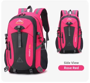 Detail of rose red 40L hiking backpack showing side compression straps and brand logo