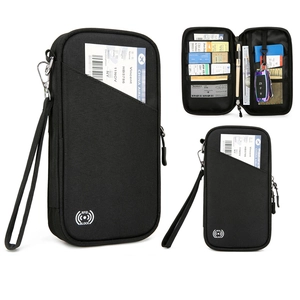 Detail showing the internal RFID blocking slots and organized pockets of the travel passport bag