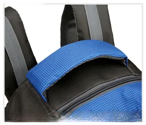 Detail of a thickened ergonomic handle on a large outdoor hiking backpack with mesh fabric