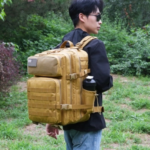 Tactical camouflage backpack with MOLLE system and US flag patch for outdoor hiking